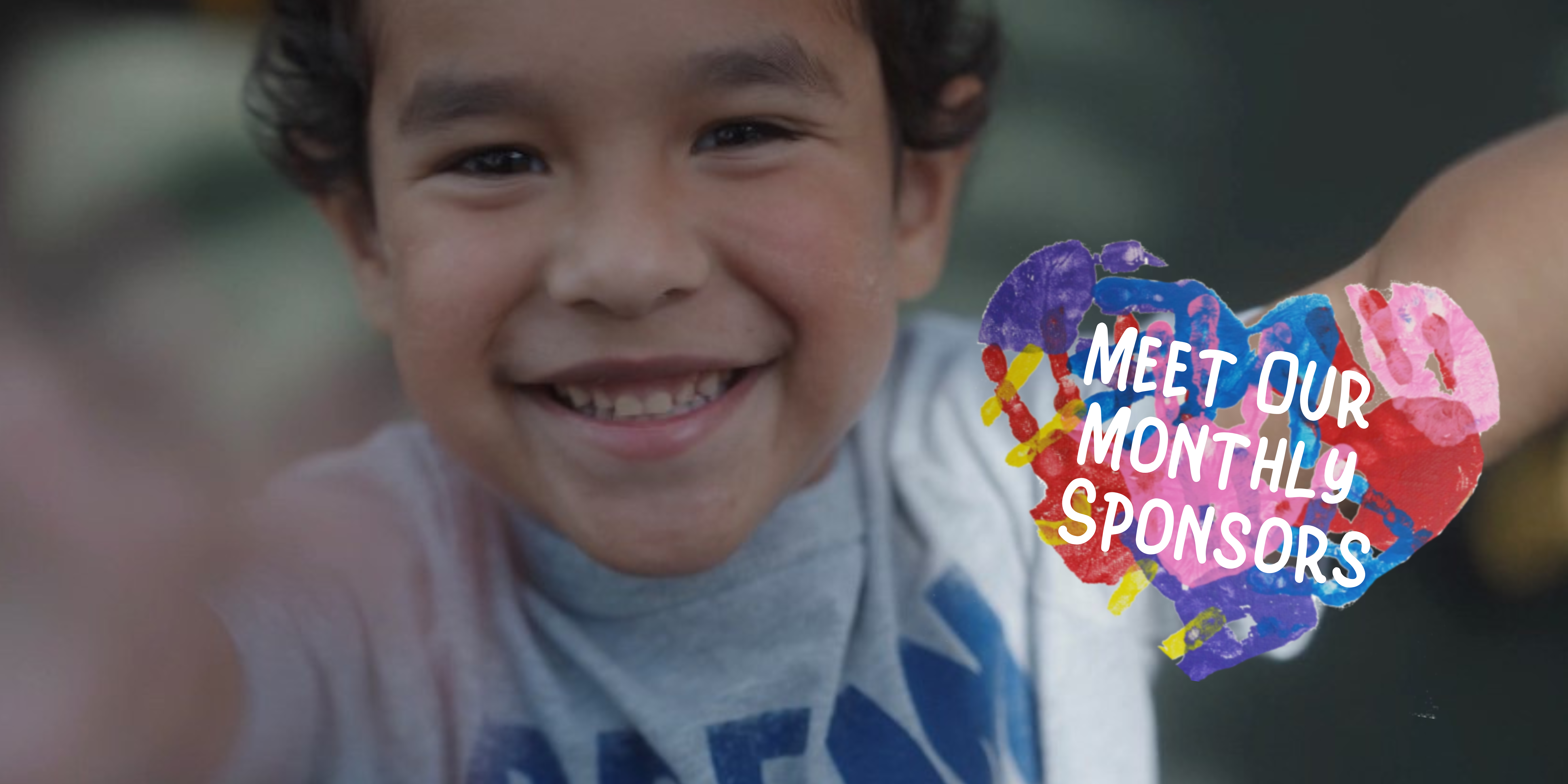 smiling boy with special needs, meet our sponsors