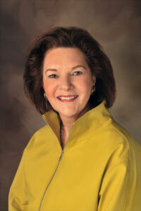 Professional headshot of Barbara B. Gentry, wearing a yellow shirt and smiling at the camera