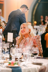 Claire Cavender McNab pictured at a gala table in formal attire
